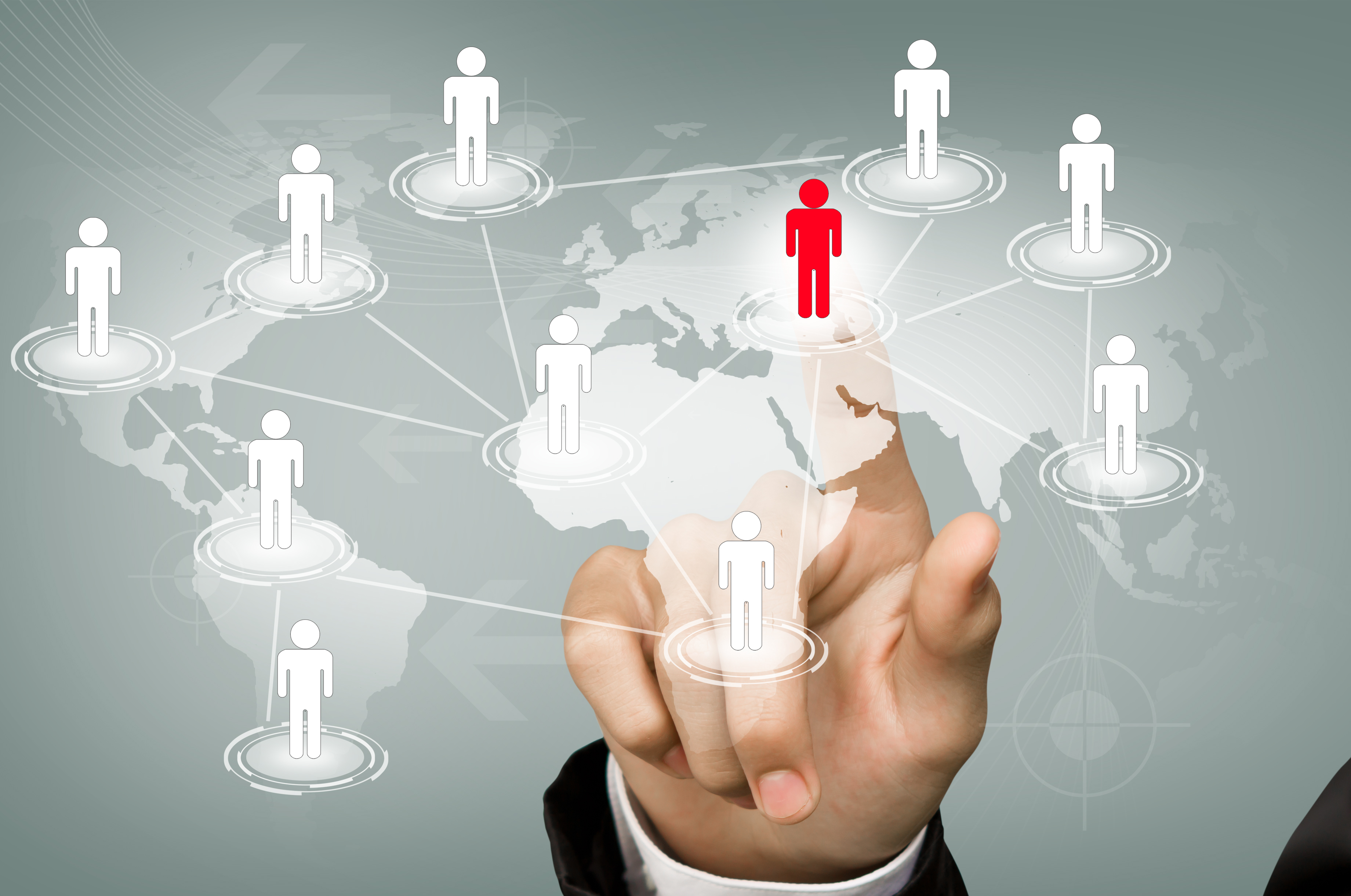 Business concept showing global network of professionals with hand selecting a candidate on world map – representing IT staffing agencies in USA connecting global talent.
